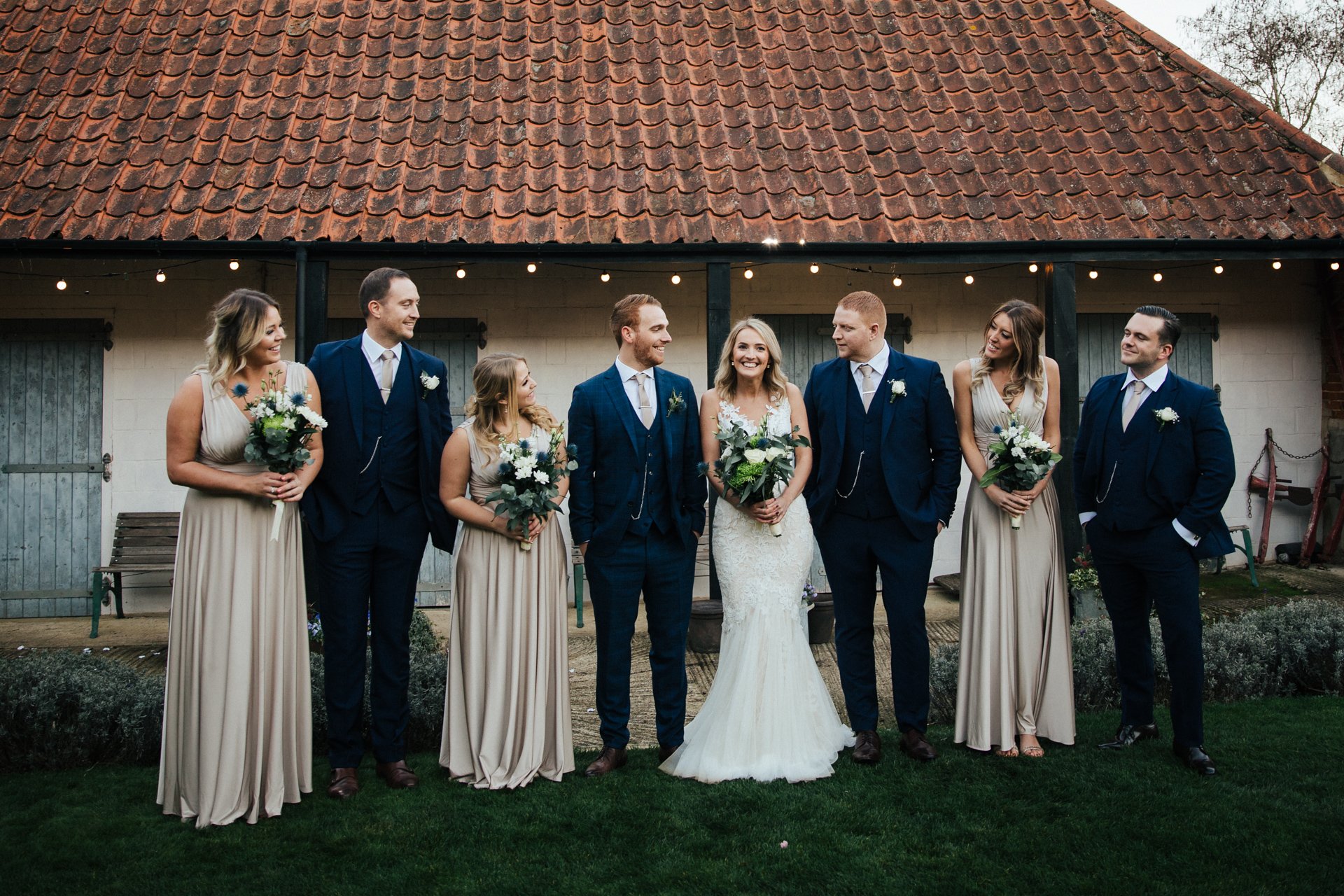 Bridal party laughing in a group shot at Granary Estates, Wedding Photography