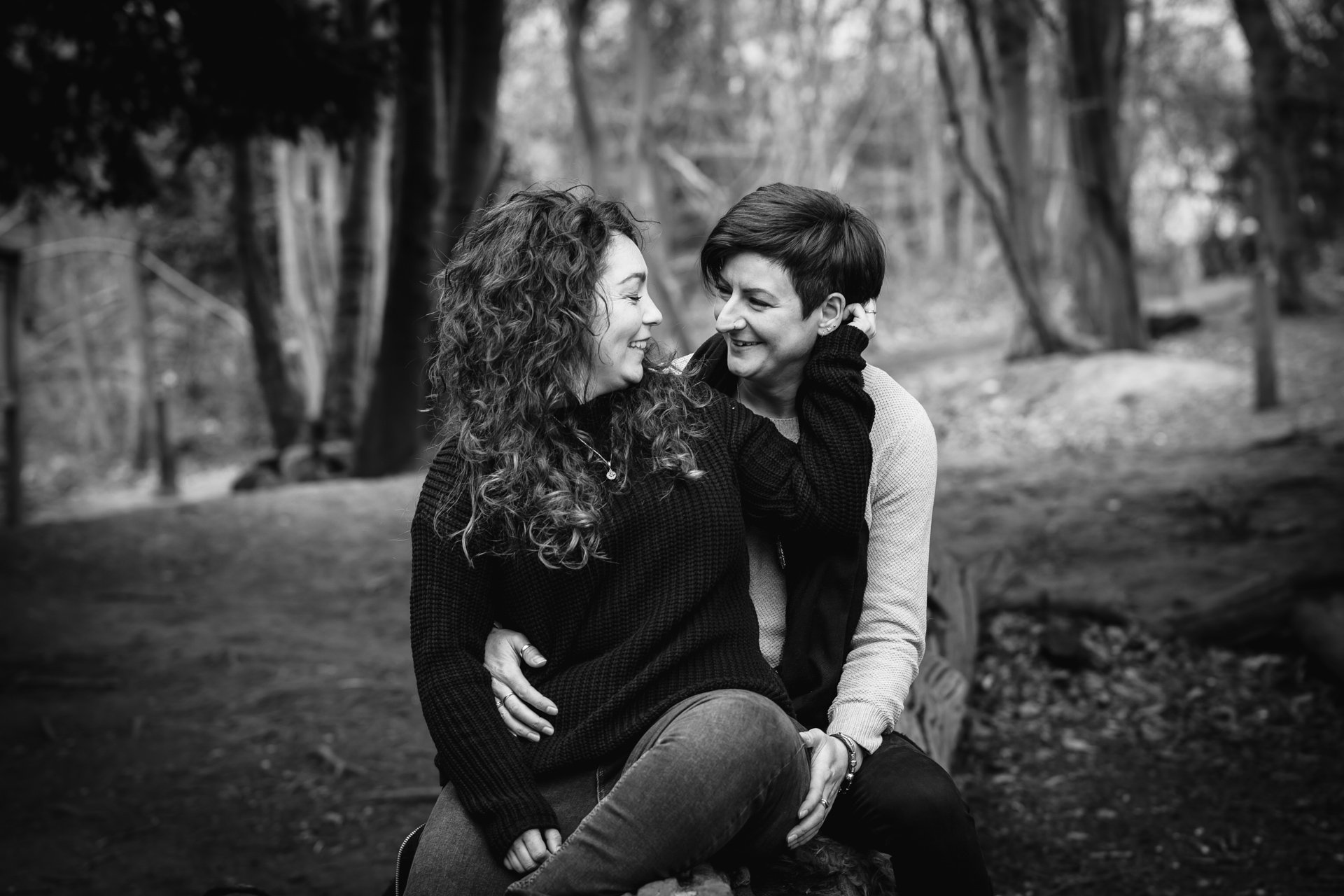 Two gorgeous ladies smiling during their engagement shoot at Shorne Woods Country Park in Kent