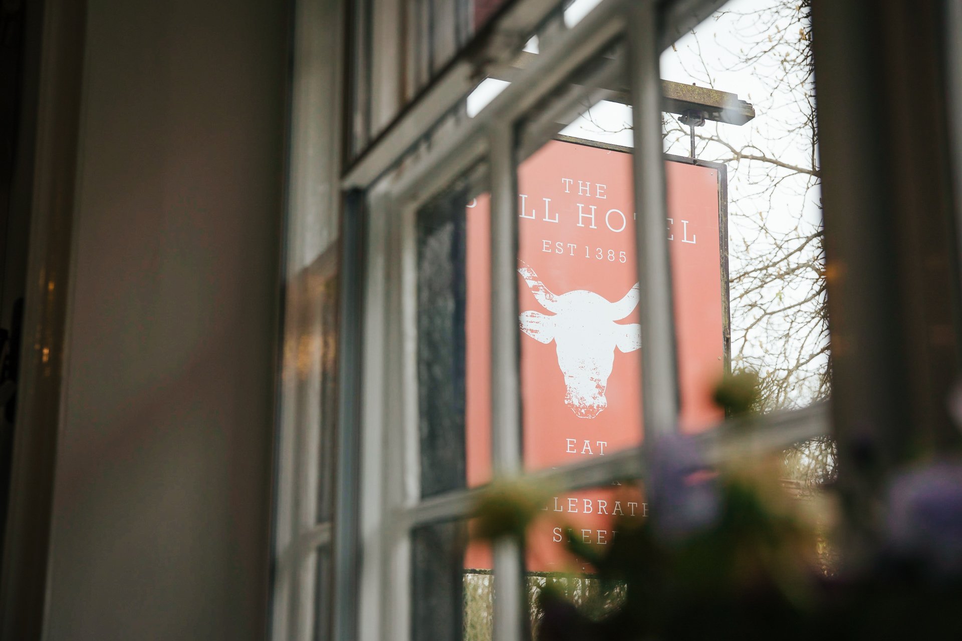 The sign of the The Bull Hotel Wrotham through their Bridal suite window