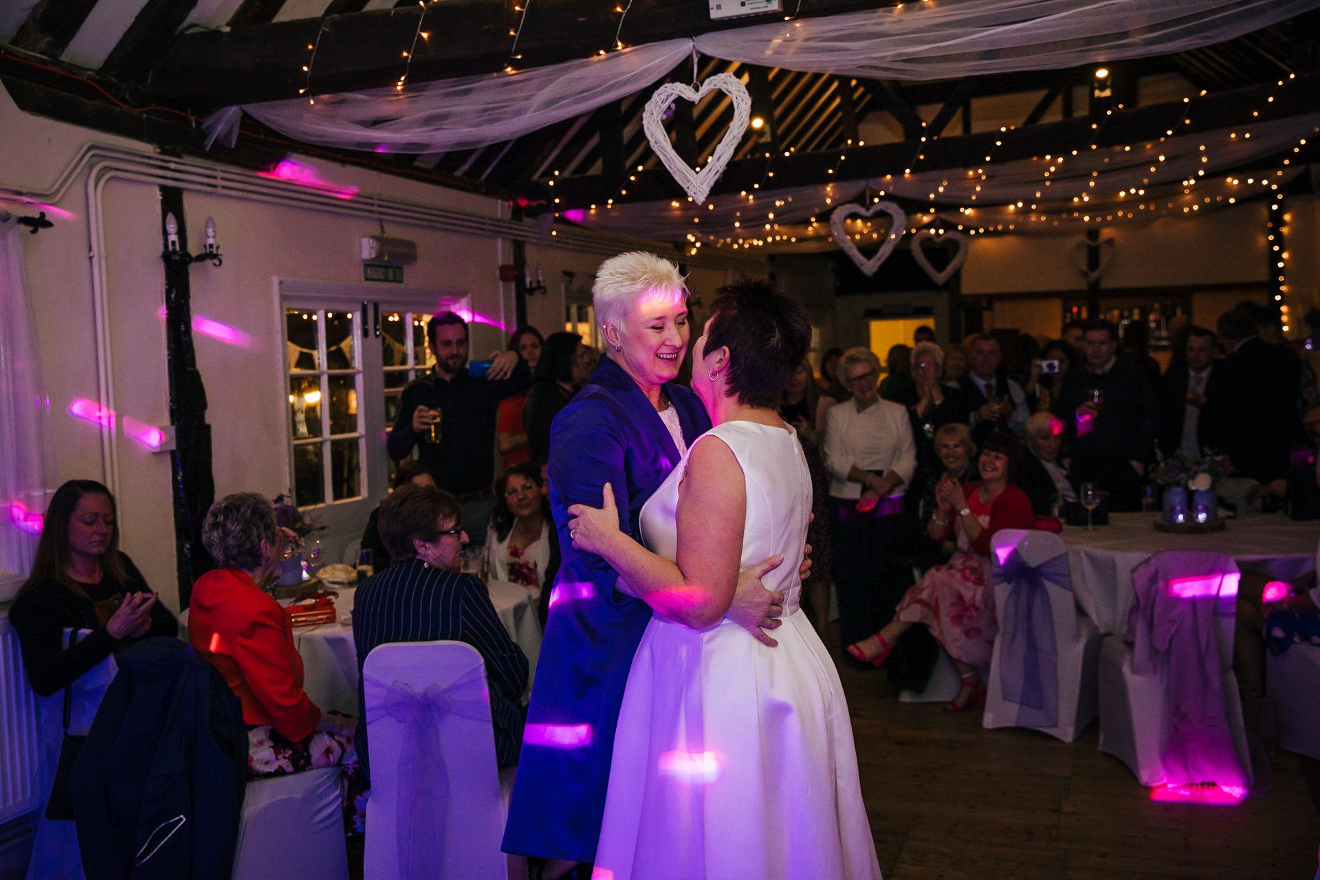 Two brides having their first dance in the Buttery at The Bull Hotel Wrotham Kent