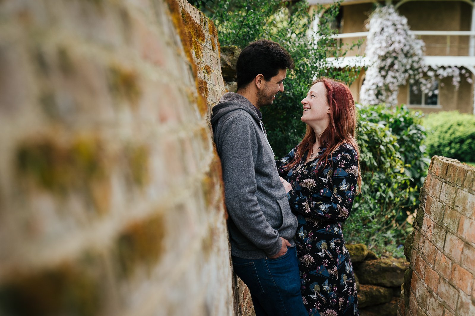 Couple leaning on wall in Swiss Gardens Bedfordshire couple shoot