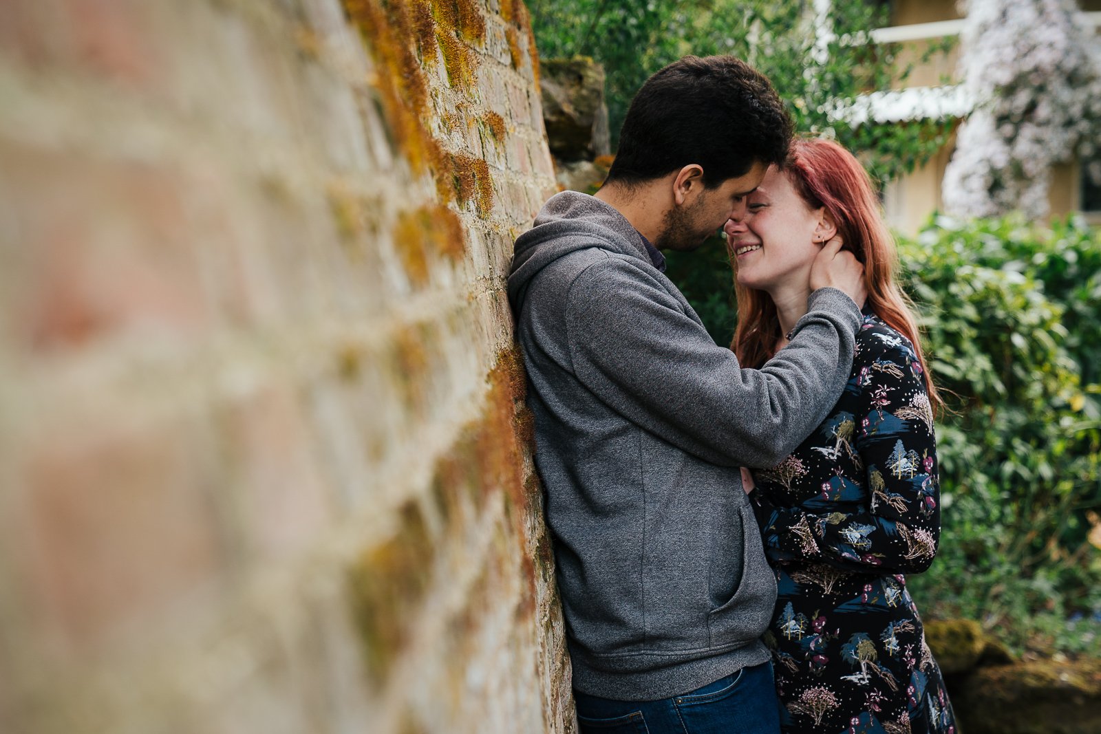 Couple leaning on wall in Swiss Gardens Bedfordshire couple shoot
