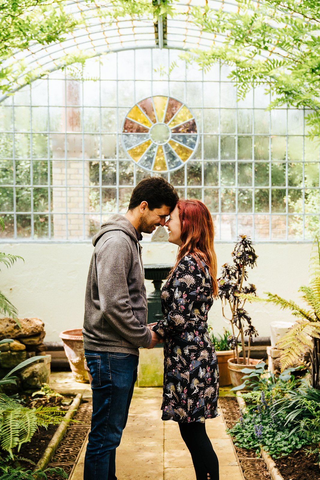 Couple smiling face to face in the grotto and fernery at Swiss Gardens Couple shoot