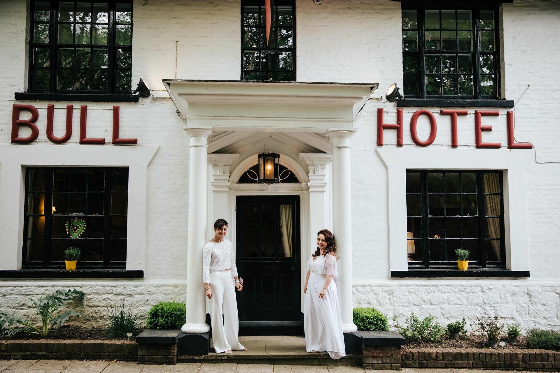 Two brides outside the Bull Hotel Wrotham after their Wedding