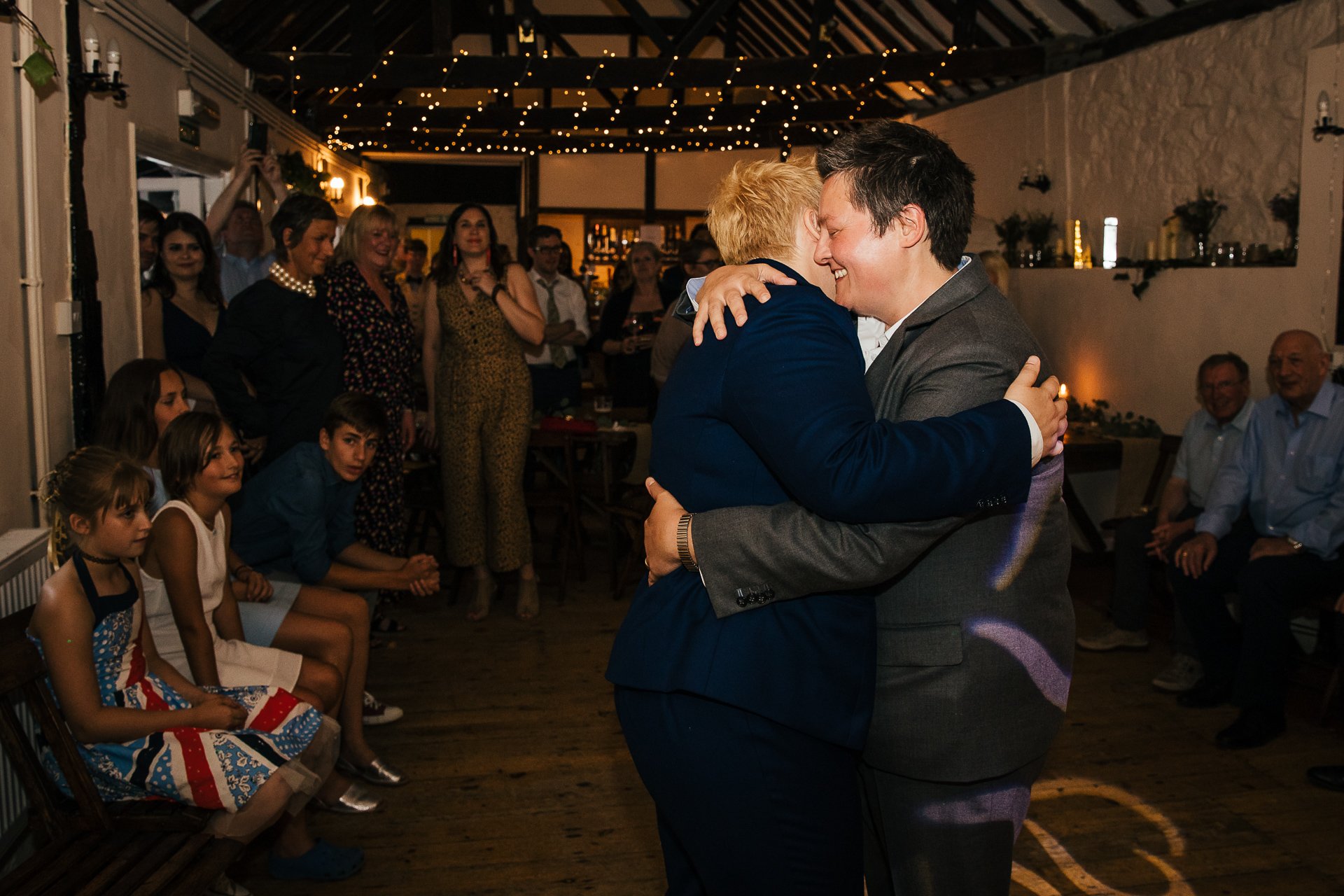 Newly wed couple embrace during their first dance