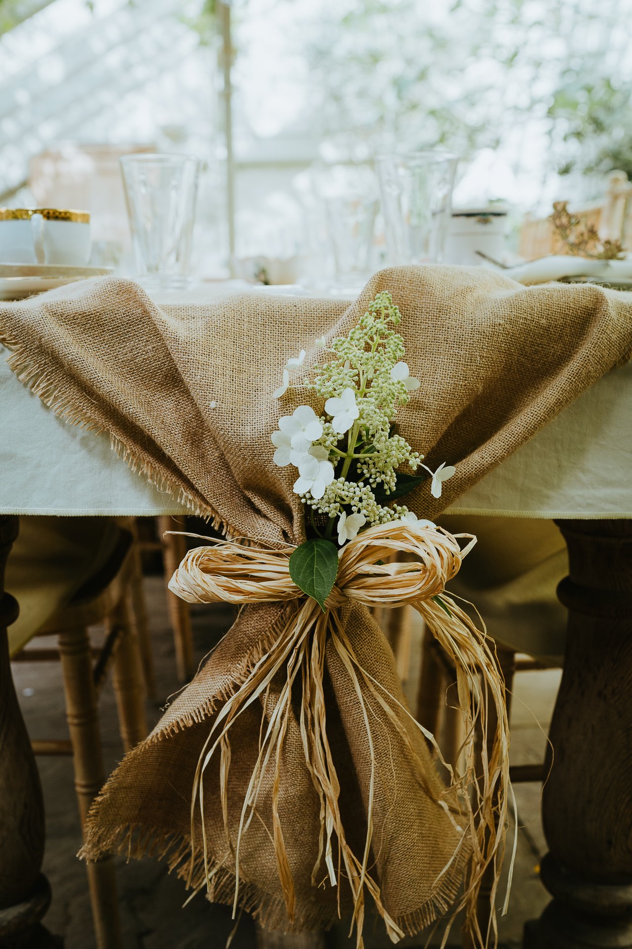 hessian table runner tied with beautiful flowers