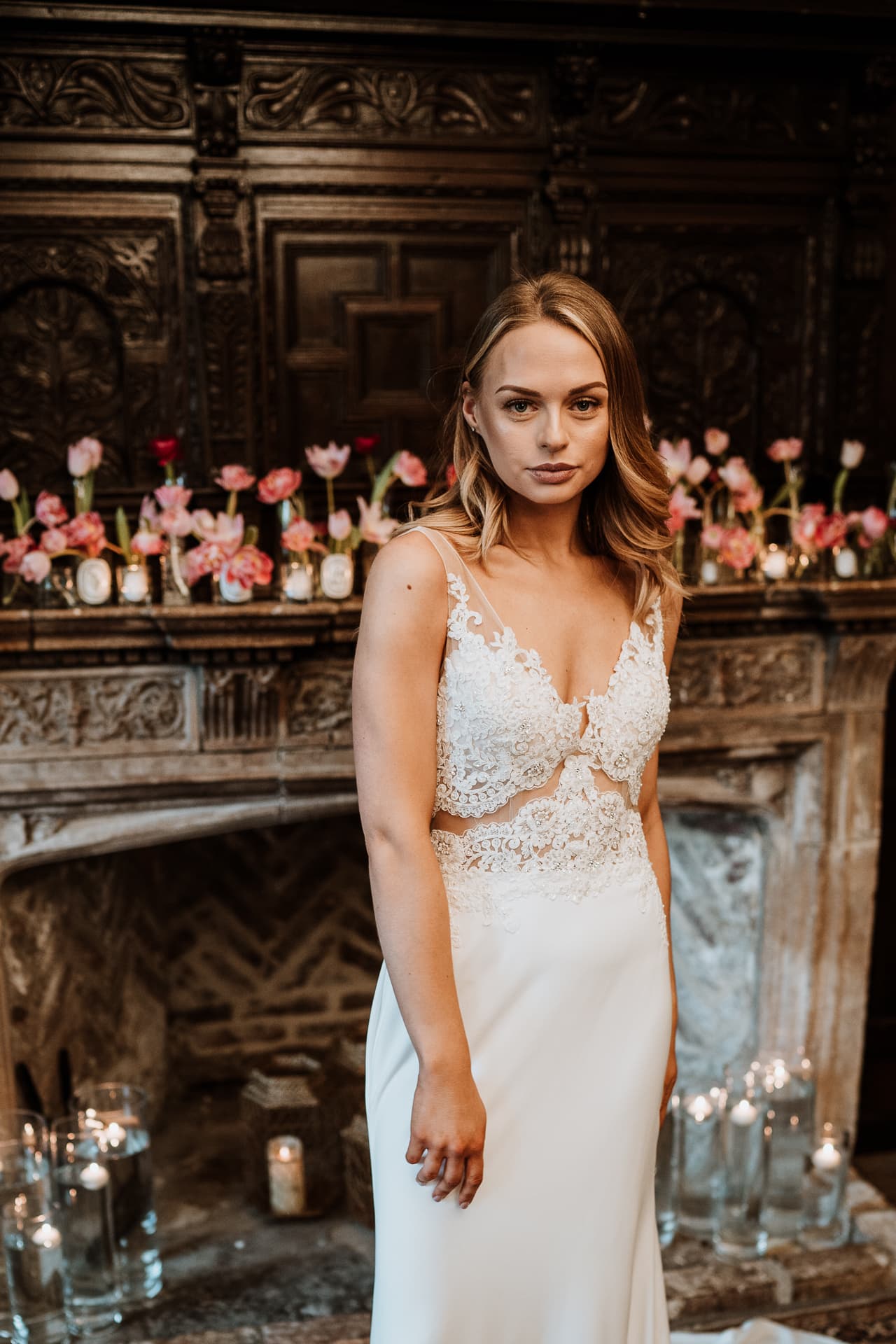 Stunning Bride in front of Bishop of Bayeux fireplace at Eastwell Manor