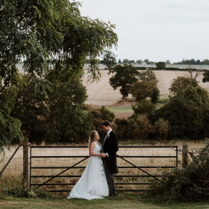 Bride and Groom at farm gate