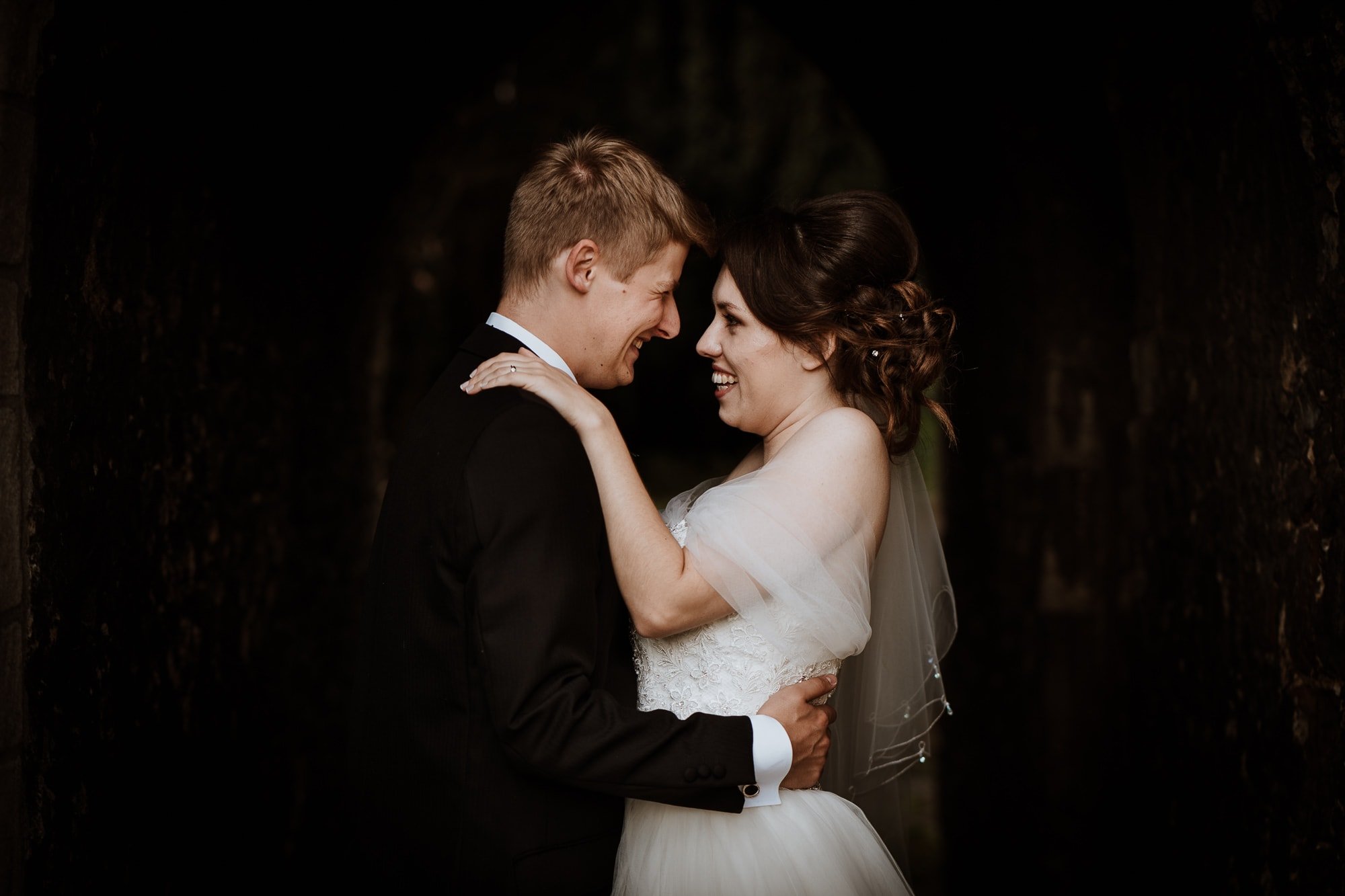 Bride and Groom laughing with each other during kent wedding portraits