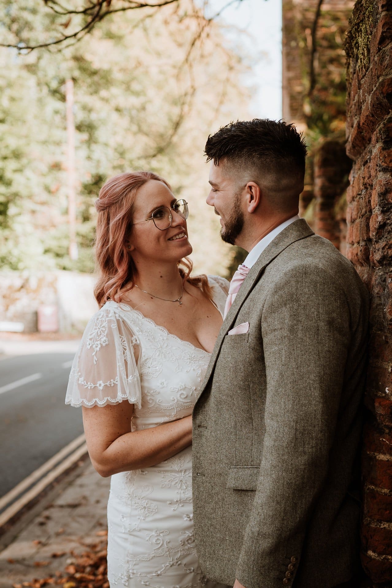 Bride and Groom smiling and looking relaxed outside the Bull Hotel in Wrotham