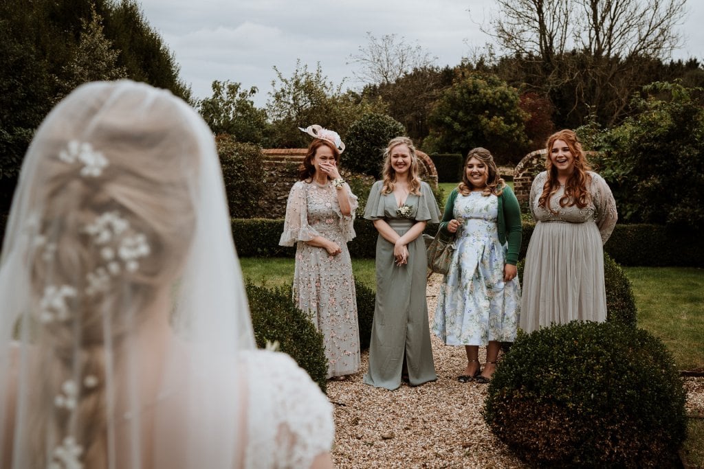 Mother of the Bride and Bridesmaids with emotional reactions to a first look of the Bride ready for her Kent Wedding