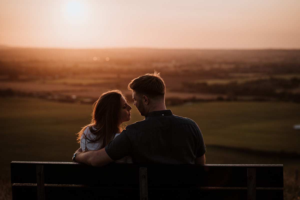 Documentary style image of Bride and Groom at sunset