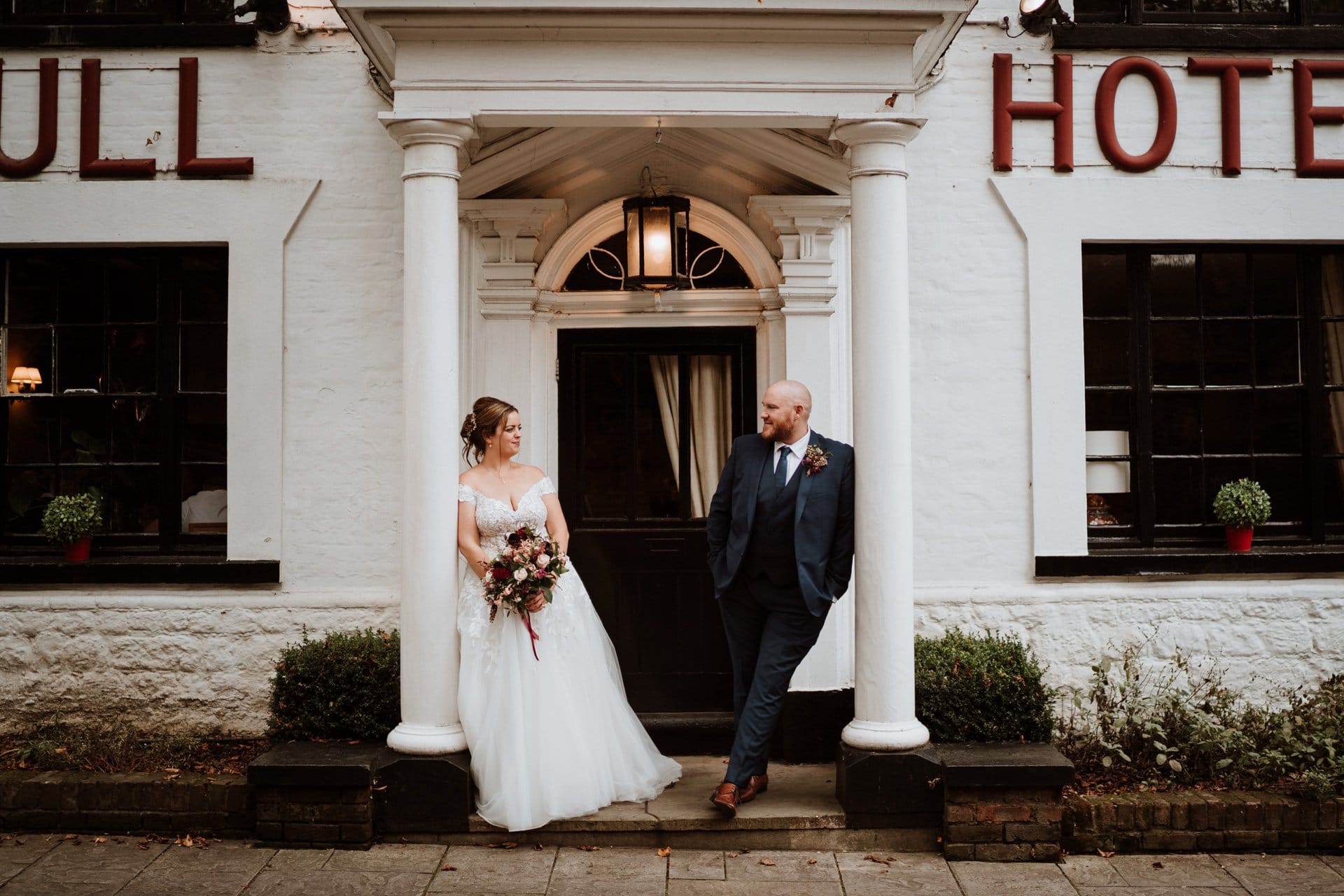 Bride and Groom on the steps of the Bull Hotel Wedding Venue