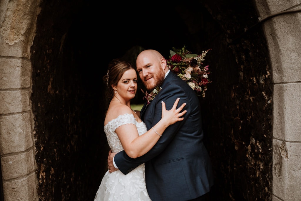 Bride and Groom confidently looking at camera during their wedding portraits