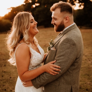 Bride and Groom laughing together at their Kent wedding venue