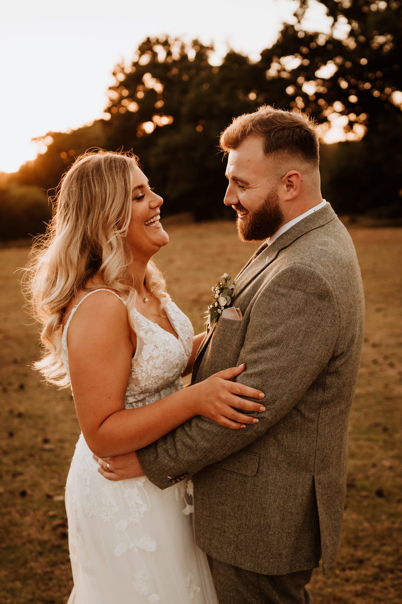 Bride and Groom laughing together at their Kent wedding venue
