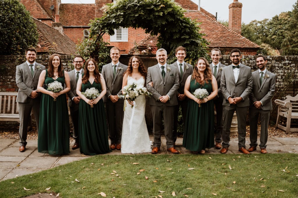 Bride, groom and bridal party at Winters Barns wedding venue in a group shot