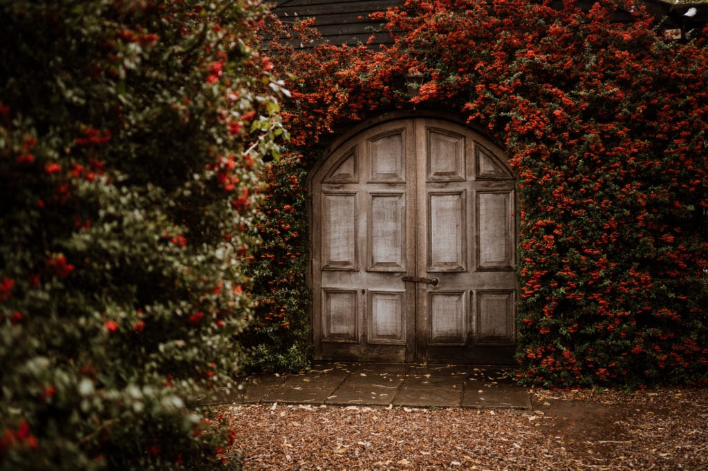 Arched wooden doors at Winters Barns, Kent Wedding venue