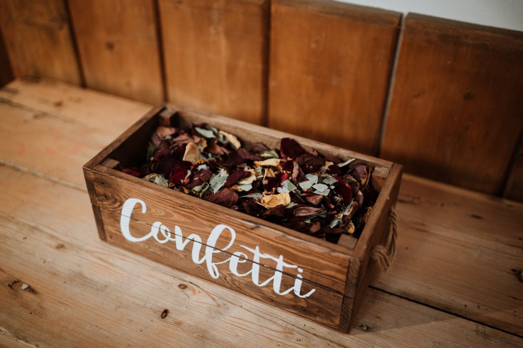Wooden box filled with dried flower confetti
