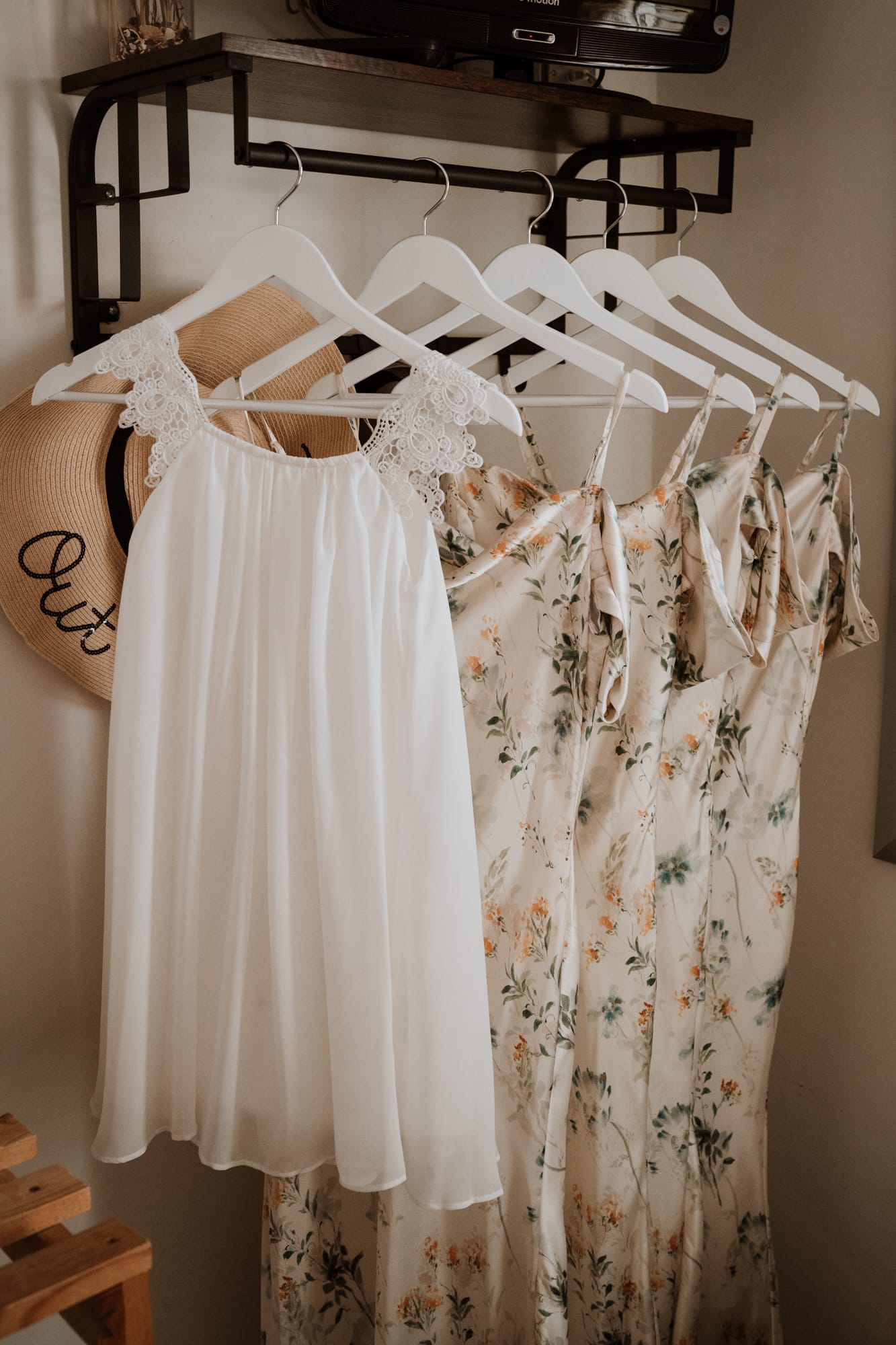 Line of bridesmaids dresses hung up