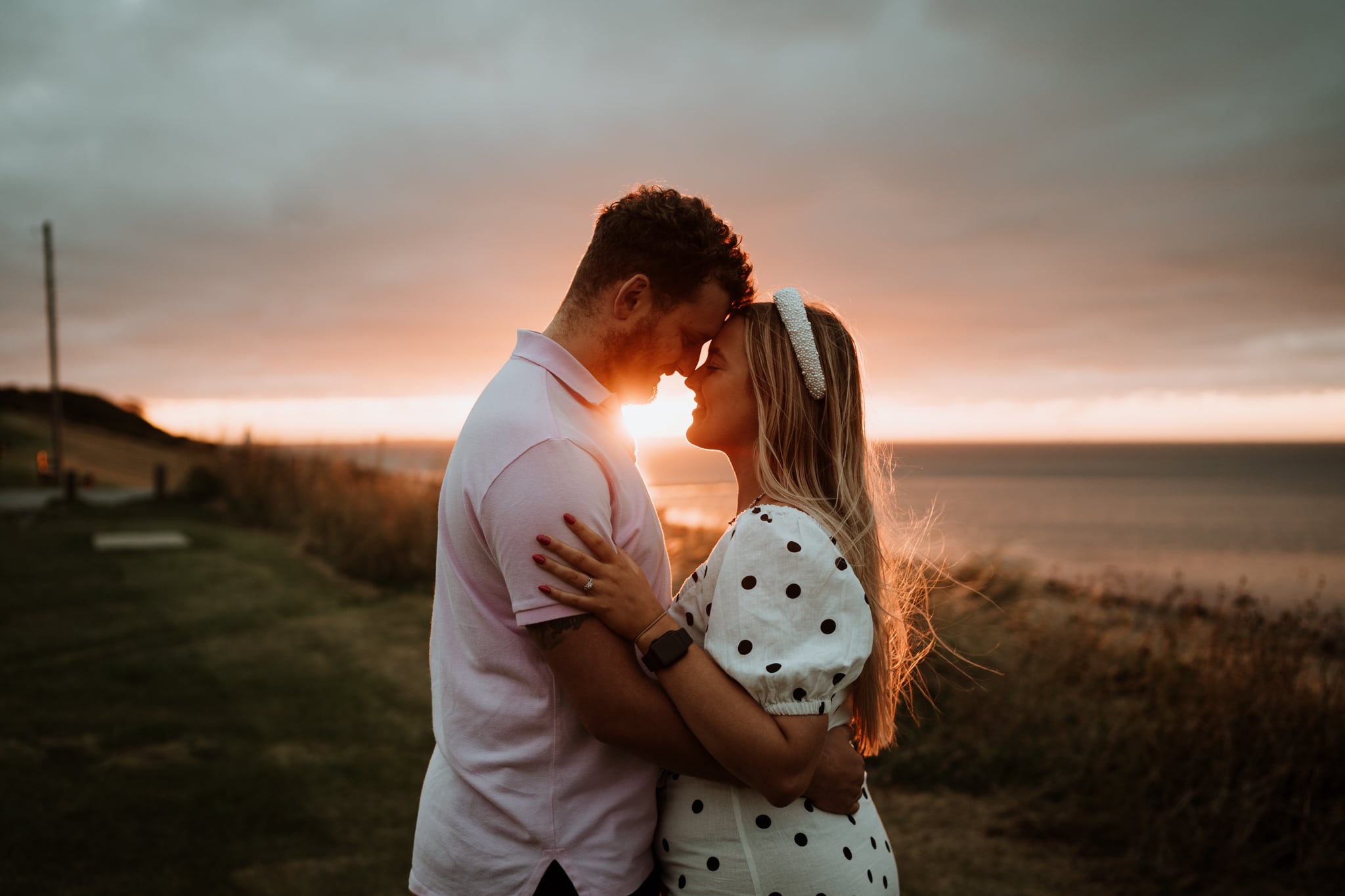 Relaxed couple during their Kent engagement shoot at sunset