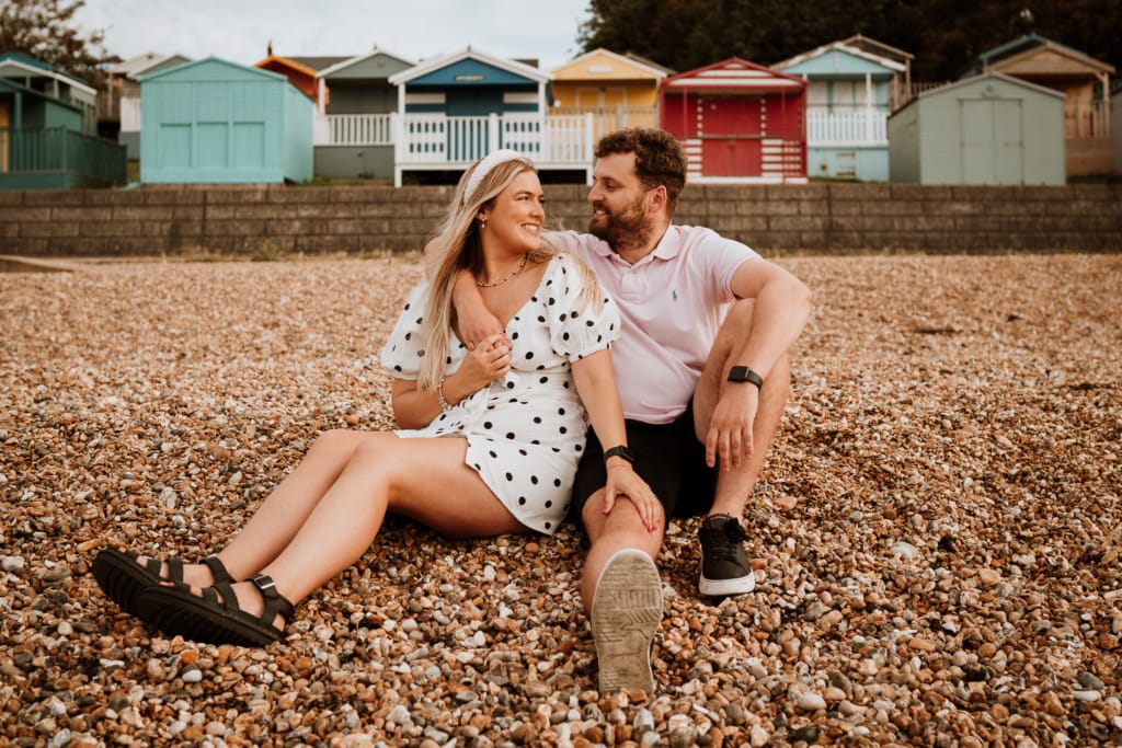 An engagement photoshoot idea is on a beach