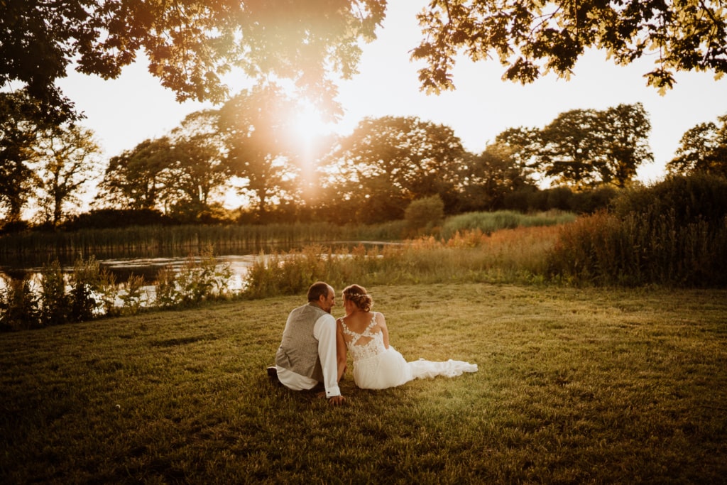 Natural wedding photos of a couple having an intimate moment together during their wedding day