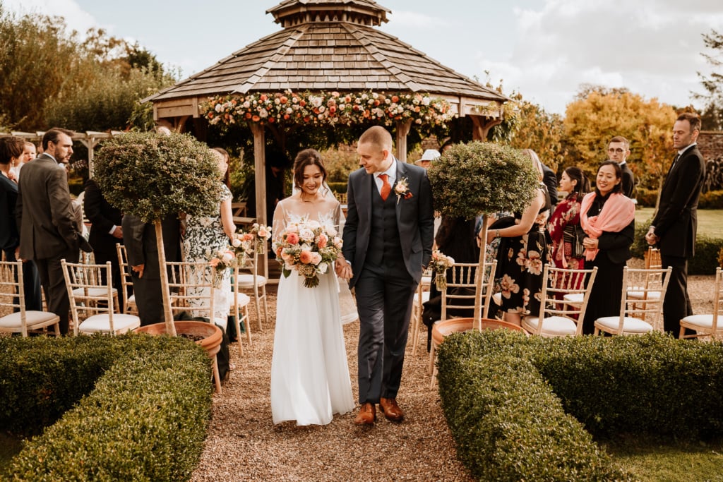 The couple during their outdoor wedding ceremony at their wedding venue in Kent