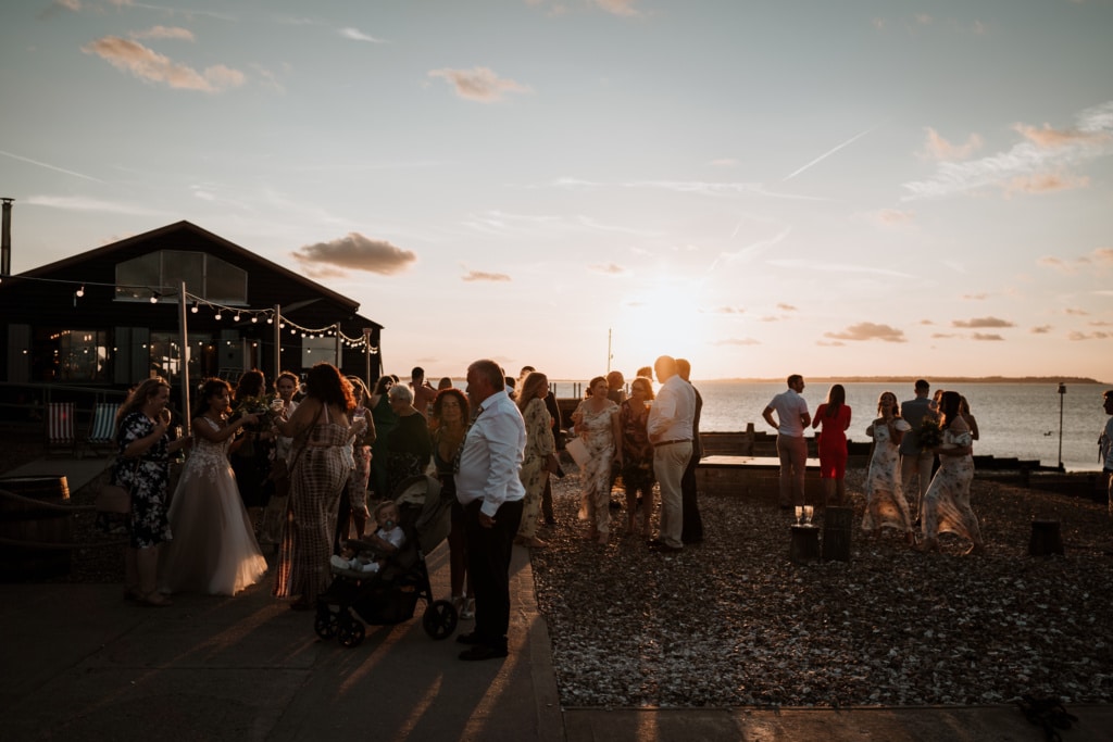Photos of the wedding guests at sunset at a Kent wedding