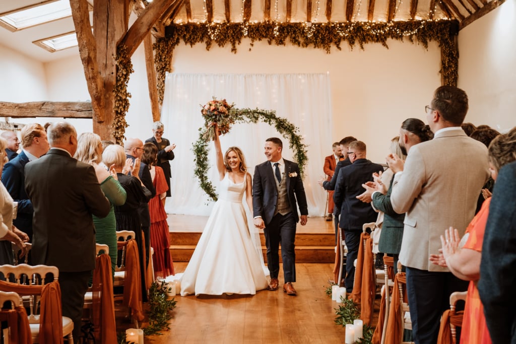 Couples photos in their wedding venue that were scheduled into their wedding day timeline